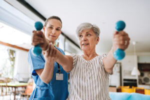 Patient at home doing physiotherapy with dumbbell
